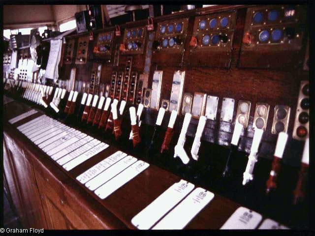 Victoria West Junction [Manchester] signal box taken around 1990, with its Westinghouse Brake and Signal Co. Ltd style 'K' miniature power lever frame photograph 4 with some interesting signal & point indicator detail.