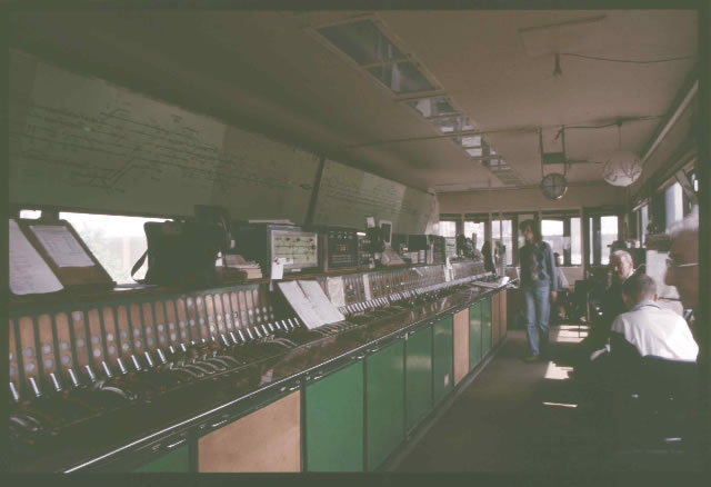 Woking signal box general interior view taken 1990's, with its Westinghouse Brake and Signal Co. Ltd miniature power lever frame, taken from Country end of frame.