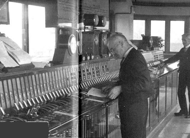 Woking signal box internior taken in 1950's, with its Westinghouse Brake and Signal Co. Ltd miniature power lever frame, notice the Sykes Block instruments and Walker Rotary Train describer, photograph 1
