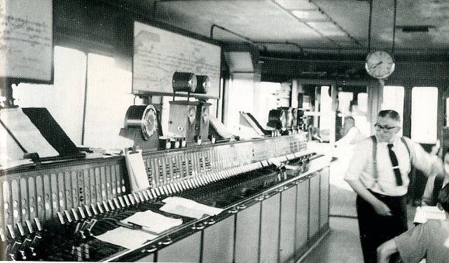 Woking signal box internior taken in 1950's, with its Westinghouse Brake and Signal Co. Ltd miniature power lever frame, notice the Sykes Block instruments and Walker Rotary Train describer, photograph 2